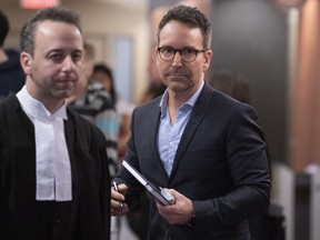 Former radio and television personality Eric Salvail walks the halls of the courthouse in Montreal on Monday, February 17, 2020.