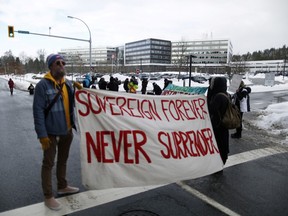 Supporters of the Wet’suwet’en nation indigenous group who oppose the construction of the Coastal GasLink pipeline, protest outside the provincial headquarters of the Royal Canadian Mounted Police (RCMP) in Surrey, British Columbia, Canada January 16, 2020.