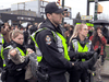 A protester is taken into custody by police on Feb. 25 at a blockade that cut off access to the Port of Vancouver for nearly 24 hours.