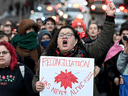 Supporters of the indigenous Wet'suwet'en Nation's hereditary chiefs march as part of protests against British Columbia's Coastal GasLink pipeline, in Montreal on Feb. 25, 2020.