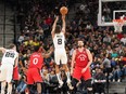 Jan 26, 2020; San Antonio, Texas, USA;  San Antonio Spurs guard Patty Mills (8) shoots a three point basket over Toronto Raptors center Marc Gasol (33) in the second half at the AT&T Center.