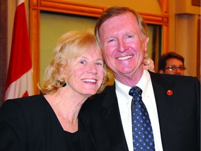 Senator Bob Runciman is greeted by his wife, Jeannette, after his swearing-in ceremony on Parliament Hill in 2010.