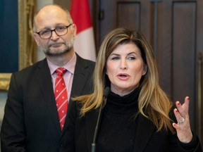 Justice Minister David Lametti listens as former Conservative MP Rona Ambrose speaks about a bill on sexual assault law training for judges, Feb. 4, 2020 on Parliament Hill.