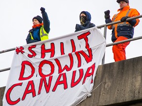 Activists protest in Port Coquitlam, B.C., on Feb. 13, 2020.