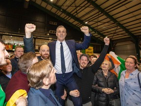 Republican Party Sinn Fein's Chris Andrews (C) celebrates his election to the Dail (Irish lower house) as the member for Dublin Bay South, at the Dublin City count in the RDS centre in Dublin, Ireland on February 10, 2020, two days after the vote took place in the Irish General Election.