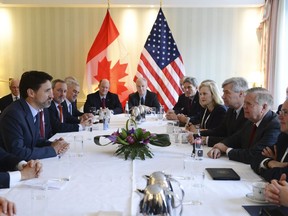 Prime Minister Justin Trudeau, second from left, meets with United States Senator Lindsey Graham, second from right, at the Munich Security Conference in Munich, Germany on Friday, Feb. 14, 2020.