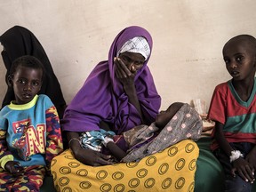 Sahro Mohamed Mumin, 30, looks at her son Abdulrahman Mahamud, two, who was diagnosed with pneumonia and severe malnutrition, at a government-run health clinic on Feb. 25, 2017, in Shada, Somalia.