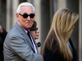 In this file photo taken on November 5, 2019 Roger Stone, former adviser to US President Donald Trump, enters the E. Barrett Prettyman United States Court House  in Washington, DC.