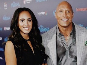 Dwayne "The Rock" Johnson and his daughter, Simone Johnson, at the film premiere of Moana (2016)