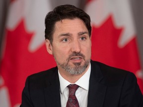 Canadian Prime Minister Justin Trudeau delivers opening remarks at a with Mayors of Canada's largest cities in Ottawa, Thursday February 6, 2020.