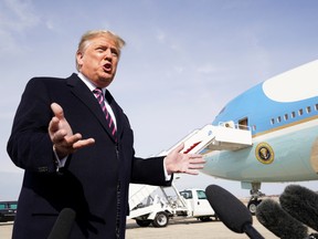 U.S. President Donald Trump talks to reporters prior to boarding Air Force One as he departs Washington for campaign travel to California from Joint Base Andrews in Maryland, U.S., February 18, 2020.