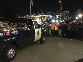 Wet'suwet'en supporters form a line to halt the progress of a police vehicle at the B.C. legislature in Victoria, Monday, Feb.24, 2020. They are there in defiance of a court injunction restricting the blockage of entrances to the building.