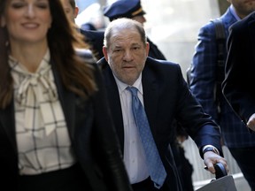 Harvey Weinstein, former co-chairman of the Weinstein Co., centre, arrives with his attorney Donna Rotunno, left, at state supreme court in New York, U.S., on Monday, Feb. 24, 2020.