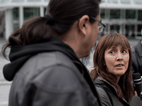 Freda Huson and her husband Toghestiy (Warner Naziel), a hereditary chief of the Wet'suwet'en First Nation, speak to reporters about a blockade they've set up against a proposed pipeline near Houston, B.C., April 7, 2014.