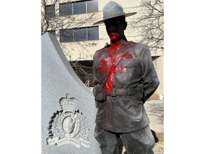Graffiti is seen on an RCMP statue outside of Manitoba RCMP headquarters in Winnipeg on Wednesday, February 26, 2020. Winnipeg police are investigating three incidents of graffiti that targeted the headquarters of the Manitoba RCMP, the Canadian Museum For Human Rights and a politician's office.