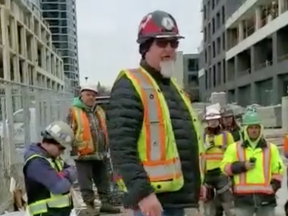 Jack Da Silva is seen addressing the workers.