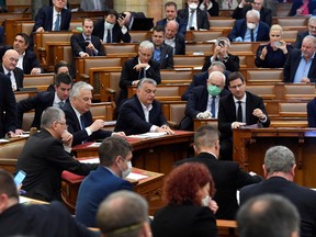 Hungarian Prime Minister Viktor Orban votes the law granting the government special powers to combat the coronavirus disease (COVID-19) crisis at the Hungarian parliament in Budapest, Hungary, March 30, 2020.