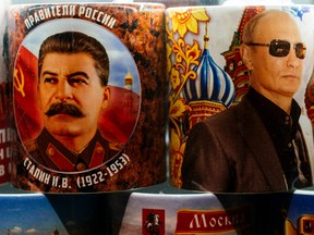 Mugs decorated with images of Russian President Vladimir Putin and Soviet leader Joseph Stalin are seen on sale among other items at a gift shop in Moscow on March 11, 2020.