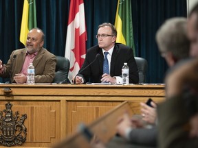 Saskatchewan's Provincial Chief Medical Health Officer Dr. Saqib Shahab speaks , left, speaks while Jim Reiter, Minister of Health, looks on during an update on COVID-19 at the Legislative Building in Regina on Wednesday March 11, 2020.