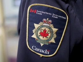 Patches are seen on the arm and shoulder of a corrections officer in the segregation unit at the Fraser Valley Institution for Women during a media tour, in Abbotsford, B.C., on Thursday October 26, 2017.