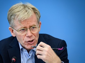 Team leader of the joint mission between World Health Organization (WHO) and China on COVID-19, Bruce Aylward gives a press conference at the WHO headquarters in Geneva on February 25, 2020.