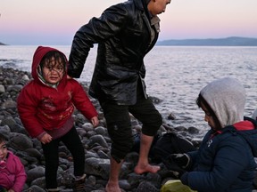Refugees and migrants land ashore the Greek island of Lesbos on March 2, 2020.