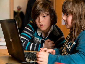 French students do school work online on March 17, as much of the country is locked down to prevent the spread of COVID-19.