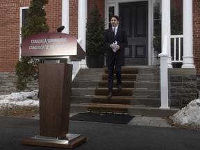 Prime Minister Justin Trudeau makes his way to the podium for a daily news conference on Canada's response to the COVID-19 pandemic outside Rideau cottage in Ottawa, Friday, March 20, 2020.