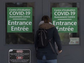 A person makes their way to a COVID-19 assessment facility Saturday, March 14, 2020 in Ottawa.