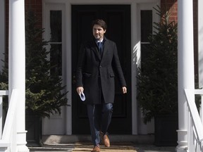 Prime Minister Justin Trudeau steps out of Rideau Cottage to speak with the media about measures Canada will enact to fight the COVID-19 virus in Ottawa, Monday March 16, 2020.