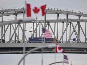 A truck crosses the Bluewater Bridge border crossing between Sarnia and Port Huron. U.S. President Donald Trump and Prime Minister Justin Trudeau agreed on March 18 to bar travellers crossing the world’s longest land border for “recreation and tourism” purposes.