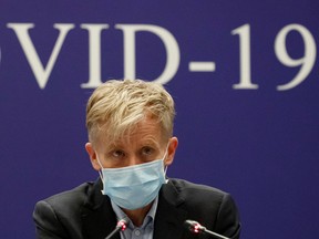 Bruce Aylward of the World Health Organisation (WHO) attends a news conference of the WHO-China Joint Mission on COVID-19 about its investigation of the coronavirus outbreak in Beijing, China, Feb.24, 2020.