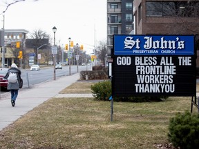 A sign seen from a church after movement restrictions came into effect due to coronavirus disease (COVID-19) in the border town of Cornwall, Ontario, Canada March 25, 2020.