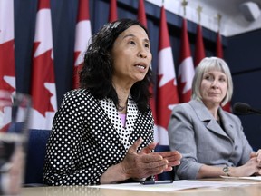 Chief Public Health Officer of Canada Dr. Theresa Tam speaks as Minister of Health Patty Hajdu listens, during an update on coronavirus disease (COVID-19) at the National Press Theatre in Ottawa, on Wednesday, March 4, 2020.