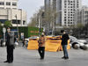 People wearing face masks line up outside a supermarket in Wuhan, the epicentre of China’s COVID-19 coronavirus outbreak, March 26, 2020.