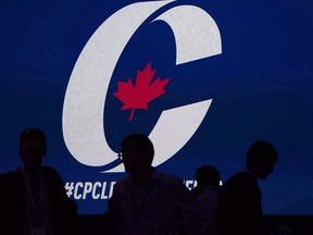 Supporters take their seats during the opening night of the federal Conservative leadership convention in Toronto on Friday, May 26, 2017.