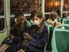 Commuters, wearing protective face masks, ride the Vaporetto boat line in Venice, Italy, on March 5, 2020. The coronavirus outbreak has hit particularly hard in Italy.