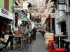 Restaurant staff wait for customers along a largely empty Haji Lane, as tourism takes a decline following the coronavirus outbreak in Singapore March 3, 2020.