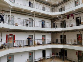 Patients who have been cured of the novel coronavirus disease (COVID-19) and discharged from hospitals exercise at a quarantine center in Wuhan, the epicentre of the novel coronavirus outbreak, in Hubei province, China March 12, 2020.