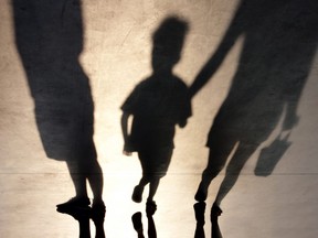 Blurry shadow of two person and a kid