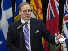 Mantiba Finance Minister Scott Fielding speaks with the media before a meeting with federal and provincial counterparts in Ottawa, Tuesday, Dec. 17, 2019. It's budget day in Manitoba and the Progressive Conservative government says the new fiscal plan will take into consideration the economic effects of the novel coronavirus.