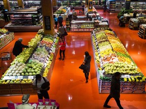 People shop for fresh produce in Toronto on Thursday, May 3, 2018. Statistics Canada says the consumer price index in February rose 2.2 per cent compared with a year ago.