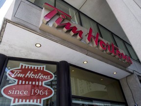 A Tim Hortons coffee shop is shown in downtown Toronto on Wednesday, June 29, 2016. Tim Hortons says it will stop accepting reusable cups brought in by customers amid concerns about the novel coronavirus outbreak.