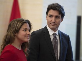 Prime Minister Justin Trudeau and his wife Sophie Gregoire wait for the arrival of Governor General Julie Payette before the Throne Speech at the Senate in Ottawa, Thursday, Dec. 5, 2019. Trudeau and his wife are in self-isolation over COVID-19 concerns, which has forced the cancellation of an in-person meeting of Canada's first ministers.