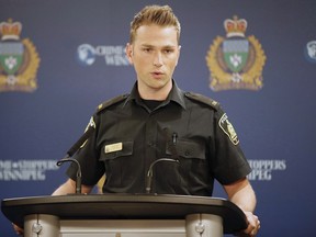 Winnipeg Police Service (WPS) Constable Jay Murray addresses media in Winnipeg on April 23, 2018. Winnipeg police say the murder of two men are connected to a feud between gangs of newcomers. Three men have been arrest for the killing of 20-year-old Rig Debak Moulebou in November. Const. Jay Murray alleges that Moulebou was killed as retaliation for a deadly nightclub shooting two days before.