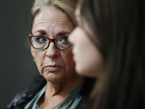 Manitoba Government Employee Union President Michelle Gawronsky listens during a press conference in Winnipeg on November 27, 2019. The union that represents workers at casinos in Winnipeg says its members are being told they will only be paid until the end of the month. The casinos are being closed due to the COVID-19 pandemic, and the Manitoba Government and General Employees Union says workers are being told they will have to use up leave time after March 31 and face temporary layoffs after that. Union president Michelle Gawronsky the province should step in and help the workers at the government-run casinos.