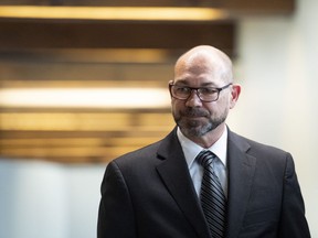Colonel Mario Dutil returns to the courtroom after a break during his court martial at the Asticou Centre in Gatineau, Que., on June 10, 2019.