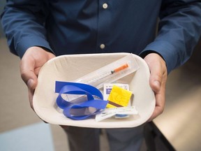 A injection kit is seen inside the newly opened Fraser Health supervised consumption site is pictured in Surrey, B.C. on June 6, 2017. A Saskatchewan police chief wants the province to provide money to help deal with potential safety impacts from the opening of a supervised drug consumption site. Saskatoon police chief Troy Cooper says the service is preparing for the opening of a facility--the first in Saskatchewan-- by AIDS Saskatoon, which practices harm reduction and supports people living with HIV, AIDS and hepatitis C.