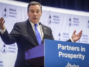 Alberta Premier Jason Kenney delivers remarks at a conference in Calgary on February 26, 2020. Kenney says his government is looking at changing workplace rules to aid workers who may need time off work during the novel coronavirus outbreak.
