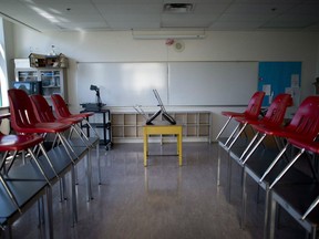 A empty classroom is pictured at McGee Secondary school in Vancouver, B.C. Friday, Sept. 5, 2014. From school closures to travel restrictions to limits on large gatherings, Canada entered a new stage in combating the spread of COVID-19 this week with measures that various experts say will almost certainly have unintended consequences.